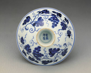 Stem bowl with design of fungus and grapes in undergraze blue