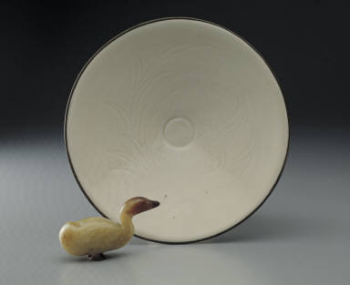 Jade duck. Bowl with incised waterfowl and lotus pond design in white glaze, Ding ware