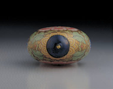 Glass bodied painted enamel snuff bottle with formalistic floral design