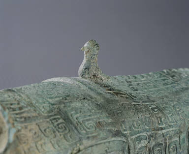 Bronze tiger with two tails and a bird on its back