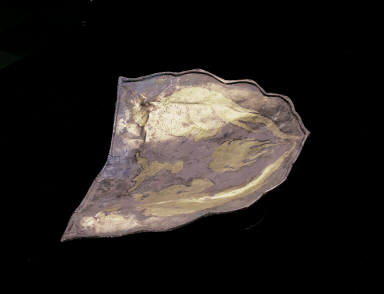 Silver headrest with chased design