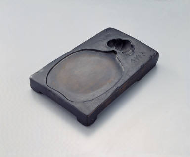 Inkstone with tied pouch design and inscription of Yuan-feng period, refined clay