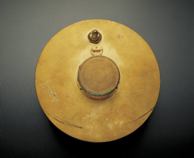 Gilt colck in the shape of sun