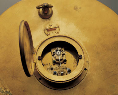 Gilt colck in the shape of sun