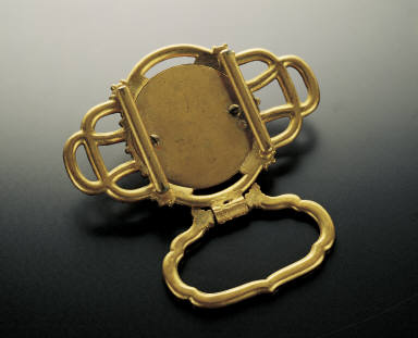 Champleve belt plaques inlaid with pearls, jewels and clock