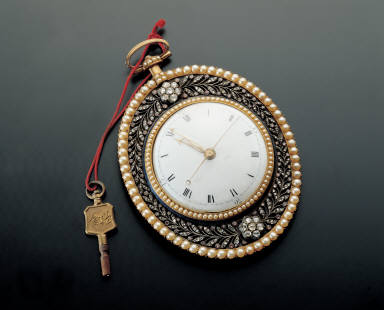 Gilt oval pocket watch inlaid with pearls and jewels
