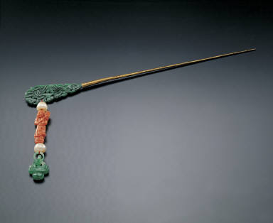 Coral and jadeite dangling hairpin in the form of a child holding the mushroom of immortality