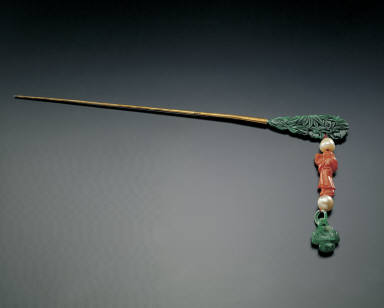 Coral and jadeite dangling hairpin in the form of a child holding the mushroom of immortality