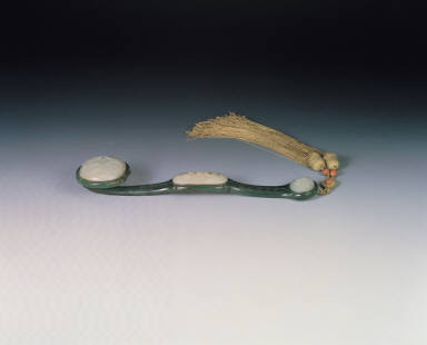 Dark green jade ru-yi scepter, with medallions inlaid with white jade and shaft inscribed with Emperor Jia-Qing's poem of 1804
