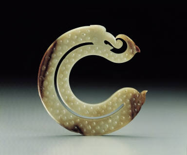 An archaistic jade pendant with dragon and phoenix motif