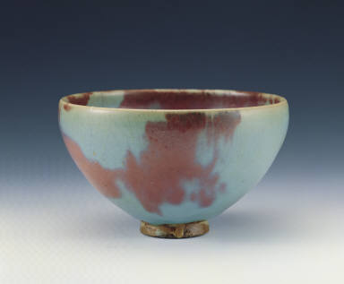 A sky-blue bowl with red splashes