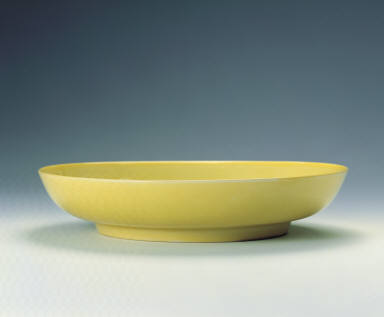 A yellow enameled dish