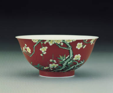 A famille rose ruby-ground bowl with plum blossoms and bamboo