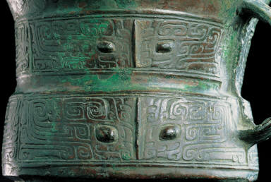 Bronze Jia vessel with animal mask decor