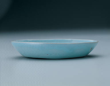 Small oval dish with light bluish-green glaze