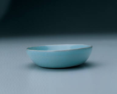 Small oval dish with light bluish-green glaze