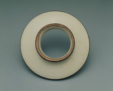 Saucer with incised lotus design in whtie glaze