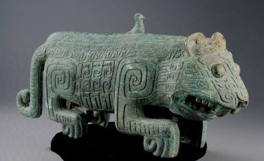 Bronze tiger with two tails and a bird on its back