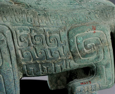 Bronze tiger with two tails and a bird on its back