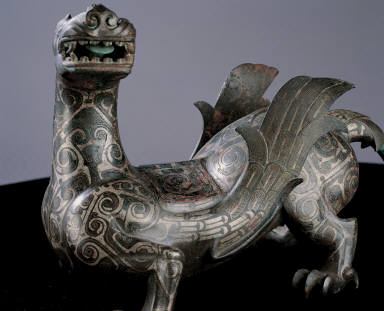 Bronze winged mythical animal inlaid with silver