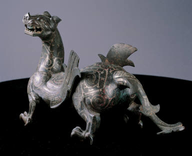 Bronze winged mythical animal inlaid with silver
