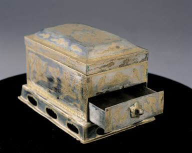 Gilt silver tea sieve with apsaras and crane amidst cloud design