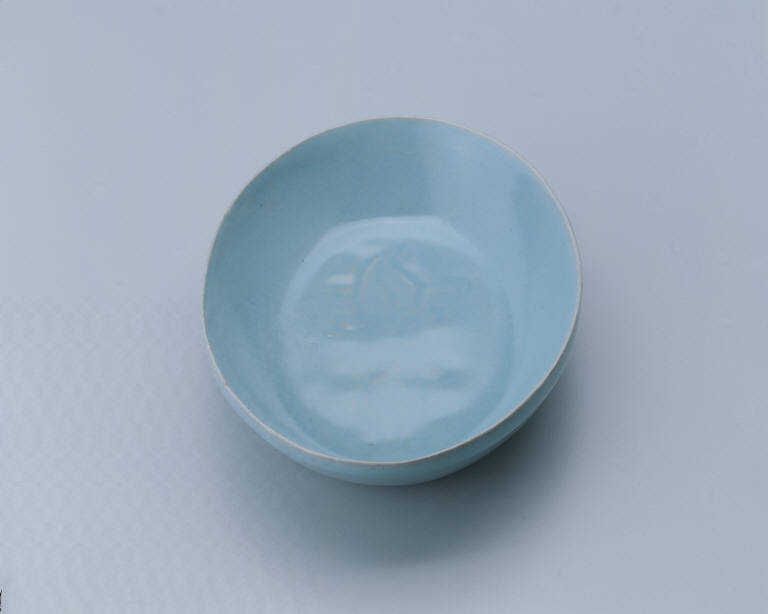 Small oval dish with light bluish-green glaze