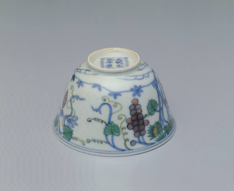 Cup with grape design in dou-cai enamels